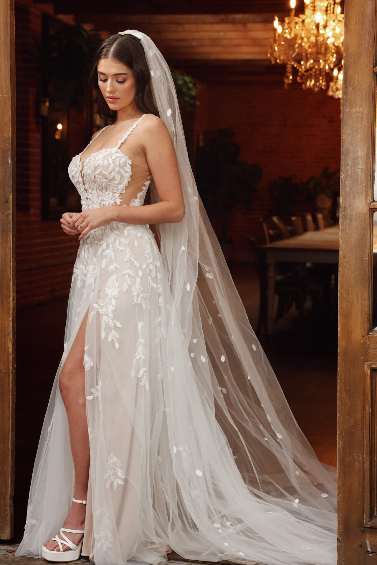 Essense of Australia wedding dress Style D4258 with lace bodice, 3D floral appliqués, sheer corset, and soft tulle A-line skirt
