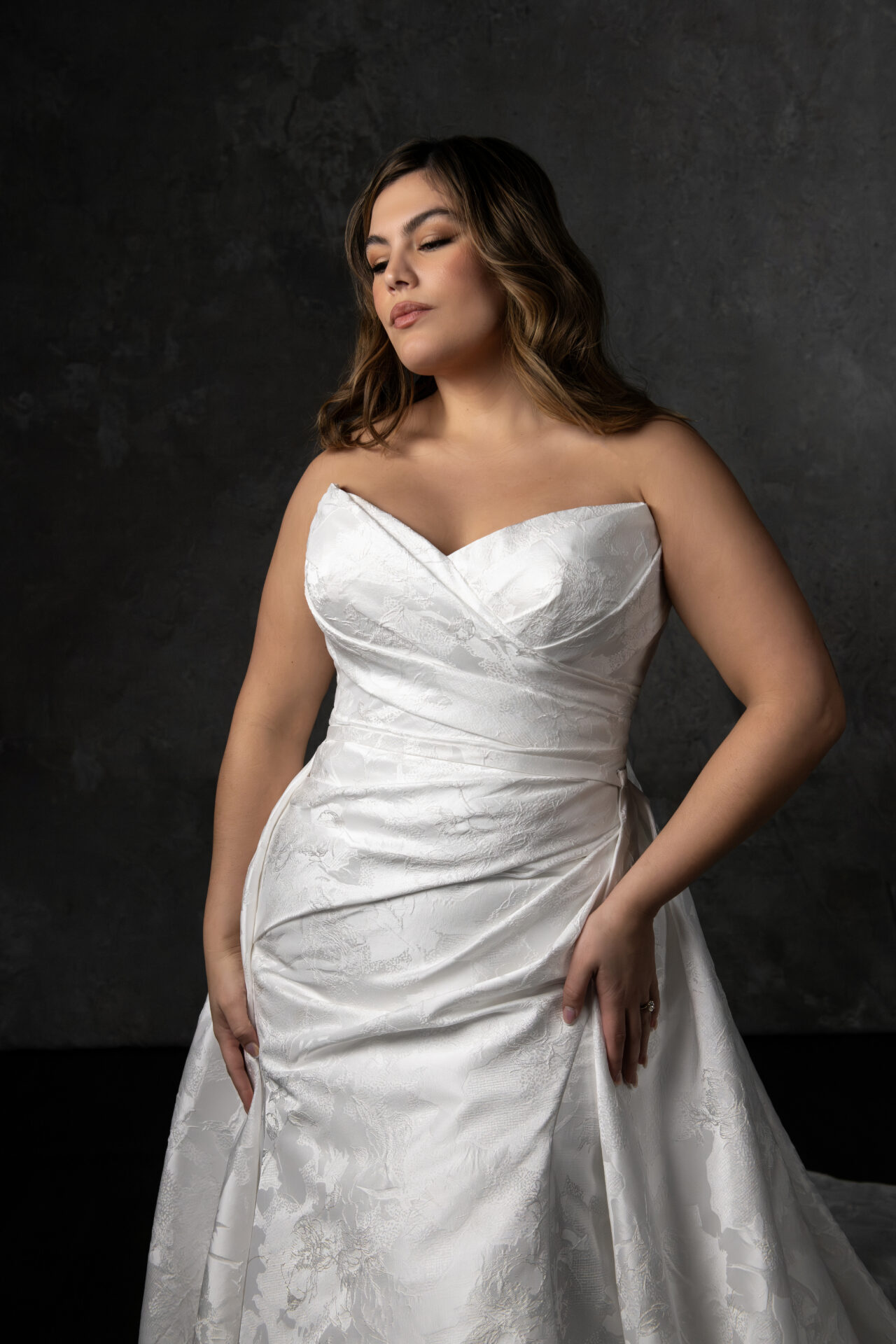 Essense of Australia wedding dress Style D4300 featuring a strapless ruched bodice, column silhouette, and detachable overskirt